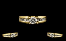 18ct Yellow Gold Attractive Diamond Set Ring the central round brilliant cut diamond of excellent