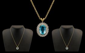 A Fine Quality & Attractive 9ct Gold Aquamarine & Diamond Set Pendant of Oval Form.