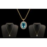 A Fine Quality & Attractive 9ct Gold Aquamarine & Diamond Set Pendant of Oval Form.