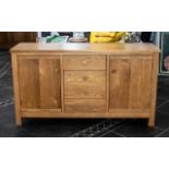 Contemporary Solid Oak Sideboard two cupboard storage areas either side four central drawers.