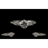 Art Deco Period Attractive and Quality Platinum Diamond Set Ring - the central round brilliant cut