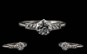 Art Deco Period Attractive and Quality Platinum Diamond Set Ring - the central round brilliant cut