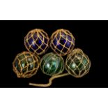 Collection of Five Victorian Witch Balls complete with rope hangers, three in green and two in blue.