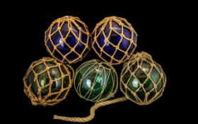 Collection of Five Victorian Witch Balls complete with rope hangers, three in green and two in blue.