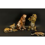 A Collection of Modern Decorative Wild Animal Figures comprising of a family of leopards.