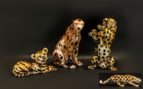A Collection of Modern Decorative Wild Animal Figures comprising of a family of leopards.