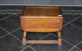 Small Oak Coffee Table with flap sides supported on turned legs. 20'' wide, 12'' deep, 16'' high.