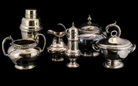 A Collection of Silver Plate to include a three piece teaset, a cocktail shaker,