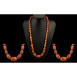 Butterscotch Coloured Graduated Beaded Necklace from the 1920s. Condition all aspects excellent.