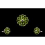 Peridot Circular Floral Style Ring, two circles of pear cut peridots, the inner circle slightly