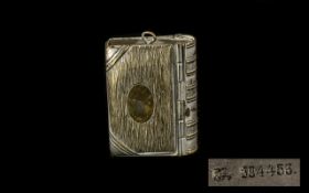 A Novelty Book Shaped Vesta Case with a compartment for sovereigns, unique item, in white metal.