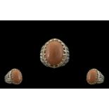 Peach Sunstone Solitaire Statement Ring, a 16ct oval cut cabochon of the sunstone, the soft peach