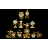 A Good Collection of Gold Gilt, & Brass Miniature Clocks, ten in total. All of solid construction.