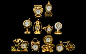 A Good Collection of Gold Gilt, & Brass Miniature Clocks, ten in total. All of solid construction.