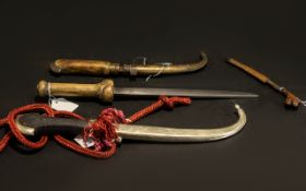 Four Daggers of Middle Eastern Interest - one shaped silvered metal dagger with scabbard horn