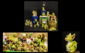 A Collection of Ceramic Ornaments comprising of figurines in boxes/tins named Cooks helper,