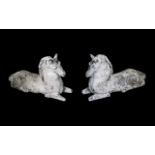Pair of Stone Composition Antique Pier Post Finials in the form of reclining horses, wearing