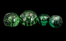 Collection Of Four Victorian Green Glass Dumps/Paperweights Of Typical Form, The Largest. Height 4.