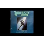 Thin Lizzy Autograph of Phil Lynott - on L.P. 'Life' - records inside - scarce.