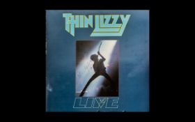 Thin Lizzy Autograph of Phil Lynott - on L.P. 'Life' - records inside - scarce.