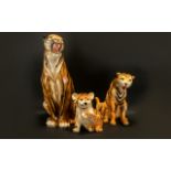 A Collection of Three Modern Ceramic Decorative Tiger Figures comprising of tall sitting tiger