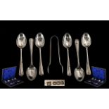 A Boxed Set of Sterling Silver Rat-tail Teaspoons and matching pair of Sugar Tongs.