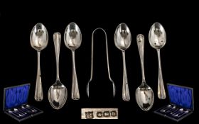 A Boxed Set of Sterling Silver Rat-tail Teaspoons and matching pair of Sugar Tongs.