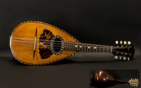 Neopolitan Mandolin Naples - 1890 circa. Made of Rosewood featuring eight strings. Bone pegs.