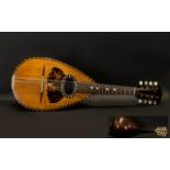 Neopolitan Mandolin Naples - 1890 circa. Made of Rosewood featuring eight strings. Bone pegs.