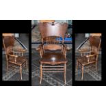 American Golden Oak Antique Scroll Shaped Spindle Backed Armchair supported by knuckle shaped arms