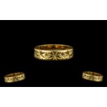 18ct Gold Wedding Band with deep cut decoration to outer side. Full hallmark London 1969.