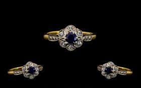Attractive 18 ct Gold and Platinum Diamond and Sapphire Set Ring - Flowerhead design.