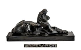 Art Deco Style Pottery Black Glazed Figure of a reclining Tiger on a base. Signed Laneranchi.