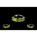 Peridot Band Ring, five square cut peridots, totalling 3.