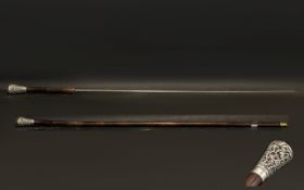 A Late 19th Century White Metal Topped Bamboo Sword Stick. Overall length 91 cm.