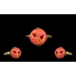 Pink Coral Carved Ring - mounted in a 9ct Gold shank. Ring size (O) Circa 1930's.