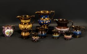 Collection of Ten Antique Staffordshire Copper Lustre Jugs, various sizes.