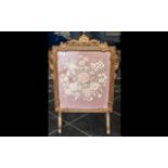 1930's Embroidered Fire Screen in Giltwood carved frame with shape feet supports. 30'' high, 22''
