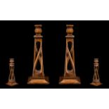 Arts and Crafts Fine Pair of Carved Oak Candlesticks of sinuous design/form. Raised on square bases.
