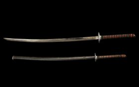 Copy Samurai Sword & Scabbard fitted with an alloy shuba with a braided wood handle. 40" in length.