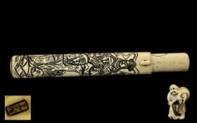 Japanese Antique Ivory Scroll Case carved to the body with figures, with belt buckle. 8.