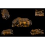 Japanese Early 20th Century Carved Boxwood Netsuke In The Form of a Wart Hog In Resting Position,