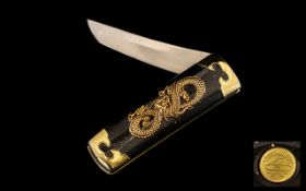 Modern Japanese Pocket Knife by Franklin Mint. Gold plated, with dragon logo.