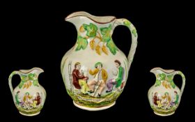 An Antique Staffordshire Pottery Ale Harvest Jug decorated and moulded to the body with drinking