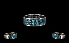 Swiss Blue Topaz Band Ring, five octagon cut Swiss blue topaz, totalling 3.