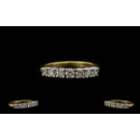 18ct Gold Attractive Seven Stone Diamond Set Dress Ring of Excellent Design. Full hallmark for 18ct.