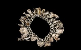 1970s Excellent Quality Silver Charm Bracelet loaded with over 25 Sterling Silver charms,