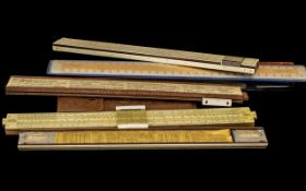 A Collection of Eight Vintage Sliding Calculating Rulers, various makers comprising (2),