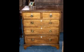 A Mahogany Chest of Drawers reconstructed from old parts with graduated drawers.