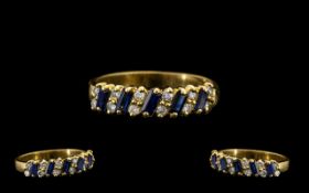 18ct Gold Nice Quality Sapphire and Diamond Dress Ring - the step cut sapphires with diamond